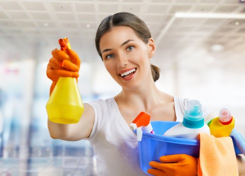 Local oven cleaner working in a compact Highbury apartment kitchen