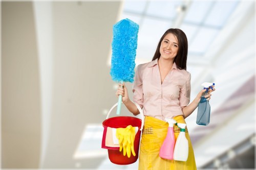Cleaner preparing an Airbnb living space in Highbury for the next guest